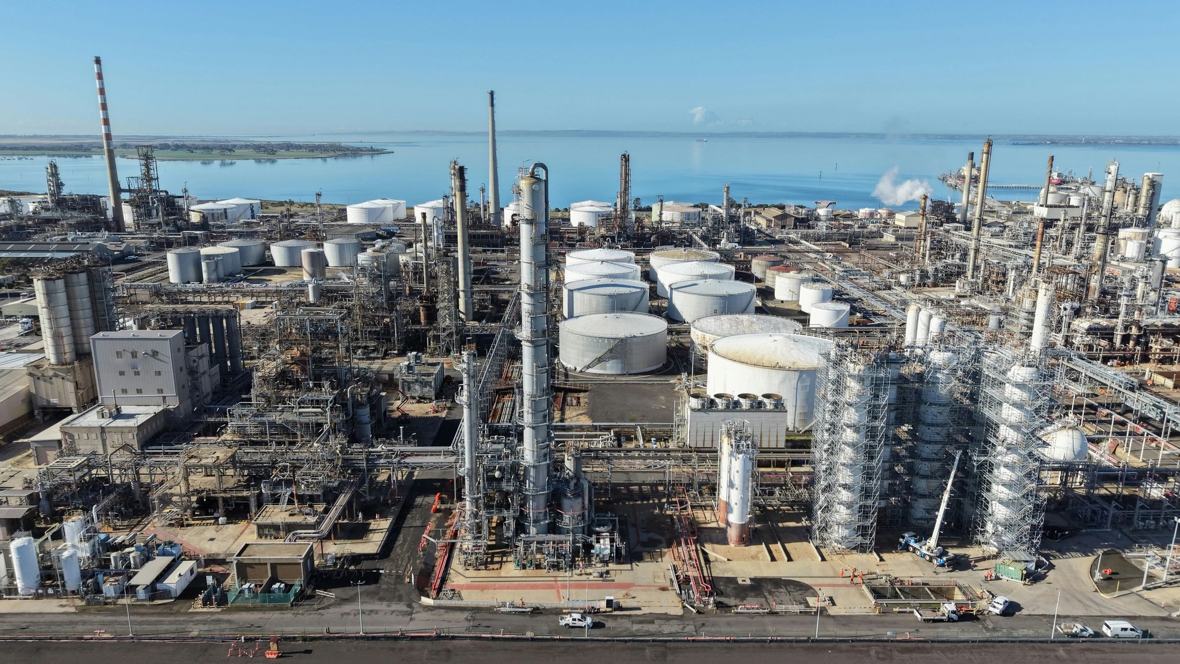 Oil refinery plant producing energy on a coastline